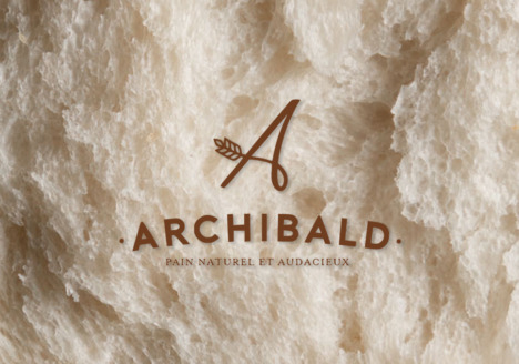 Site marchand d’Archibald réalisé par Divinemenciel : pain de campagne artisanal en gros plan, lumière chaude, texture authentique et savoir-faire boulanger.
